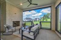 the covered porch complete with a fireplace, and remote control screens - A must have in Tennessee!