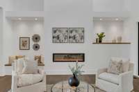 The fireplace with multiple flame color options, built in seating, and art feature walls with gallery lighting