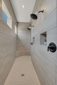 The Walk through shower with double jets and control centers.