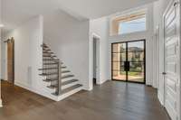 Entry with the stairs and engineered hardwood floors