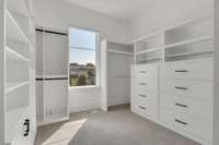 The Primary Suite's walk-in closet with custom built in shelving