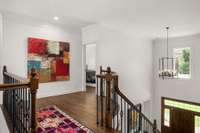 Hardwood landing at top of stairs