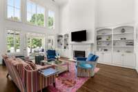 Fireplace in great room alongside built-ins