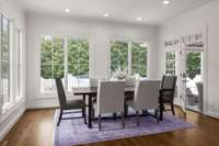 Kitchen dining space with oversized windows and ample natural light