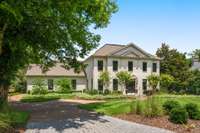 Paver driveway entry to attached garage on side of home, mature landscaping