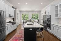 Seamless flow from kitchen into a sun-drenched kitchen dining