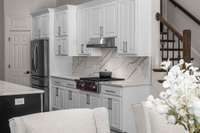 Wolf range with solid slab backsplash