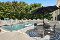 Pool area shaded by mature magnolias