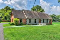 New cover on porch and new roof will make this house pop with the beautiful grounds