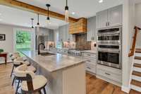 Great kitchen! Everything new! Staircase moved and lights installed on the stairway to ease your way up or down.