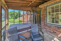 Screen porch with hot tub,