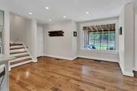 Large window looking into screen porch with hot tub