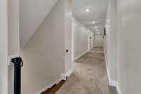 Long wide hallway upstairs to the 3 bedrooms