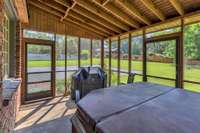 Screen porch overlooking beautiful grounds
