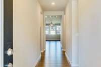 Inviting hallway with engineered hardwood.