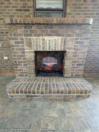 Electric Brick Fireplace in Sunroom
