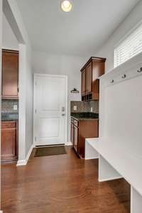 Mud Room with Built-In Desk and Cubbies and Extra Cabinet/Counter space