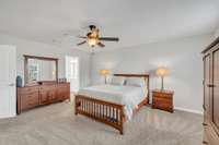 Owner's Suite is tucked away from other bedrooms upstairs