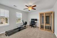 Bedroom Number 3 Upstairs is currently used as an Exercise Room. There is a Walk-In Closet and Ceiling Fan