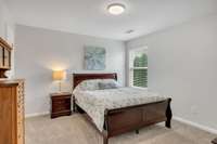Bedroom 4 is located off the Living Room/Bonus Room Upstairs with a Walk In Closet