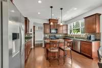 Large Kitchen with Island, Granite, Backsplash.