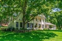 Large, mature trees—perfect for tree swings—grace the property, adding charm, shade, and timeless character.