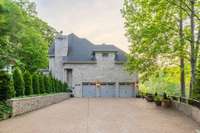 Two story, 3 bay garage can be used for 6 cars for the car enthusiast, and plenty of exterior parking is available for guests, as well