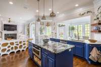 The double island kitchen opens into multiple living areas, making the layout an entertainers dream