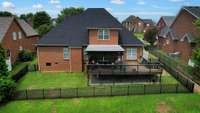 This amazing back yard is fully fenced and has a covered and uncovered deck.