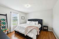 The primary bedroom features laminate flooring and a single window that brings in soft natural light. 3114 Penny Ln Murfreesboro, TN 37130