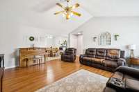 The living room features durable laminate flooring, a vaulted ceiling, and a ceiling fan for year-round comfort. 3114 Penny Ln Murfreesboro, TN 37130