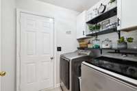 Adorable utility room featuring built-in shelving and cabinets that offer stylish and functional storage solutions. 3114 Penny Ln Murfreesboro, TN 37130