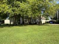 Another view of the front of the house showing the nice trees as well.