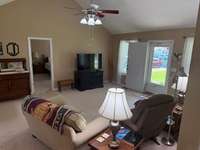 View of the living room, looking into the master bedroom.
