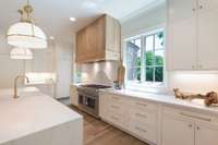 At the heart of the home, a showstopping chef's kitchen features sleek Thermador appliances, custom cabinetry, and double islands-perfect for entertaining or gathering with family.