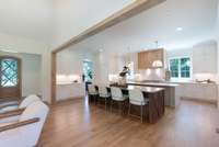 At the heart of the home, a showstopping chef's kitchen features sleek Thermador appliances, custom cabinetry, and double islands-perfect for entertaining or gathering with family.