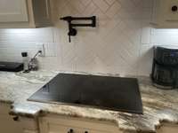 Pot filler above stove