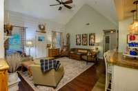 Welcome back to your centrally located greatroom looking back towards your secondary bedroom hallway