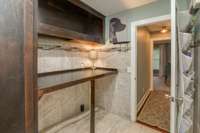 Cross the hall from your primary bedroom into your large utility room
