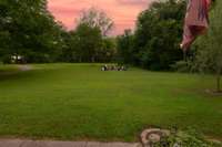 Sitting on your covered front porch looking out towards E Lyon road you will find your cozy fire pit