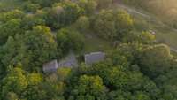 Overview of the front 5.01 acres that features the house, shop, fire pit...
