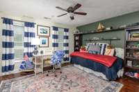 One of two secondary bedrooms of equal size, wood floors, lots of natural light