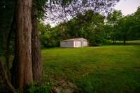 Detached two car garage or spacious workshop complete with 220 watt power all one short walk across the gravel drive from the house...