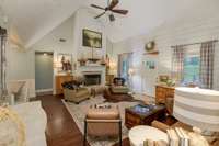 Standing in your greatroom looking towards your primary bedroom hallway and Utility room