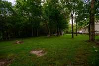 Part of your fenced rear acreage that you overlook from you stamped concrete patio