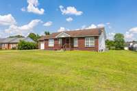 Beautiful front views with great setback from the street. Fresh paint throughout. Beautiful deck overlooking the backyard. Spacious garage.
