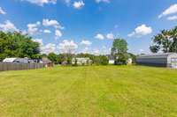 Huge, level backyard. New owners could potentially put a pool, playset, and have square foot gardens. Lots of usable space to work with.