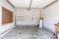 Large, attached garage includes pedestrian door to side yard.