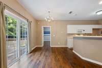 The sliding door provides additional natural light and provides access to the deck and fenced back yard.