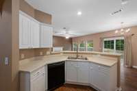 The open floorplan allows visiting with family members and guests from the kitchen.
